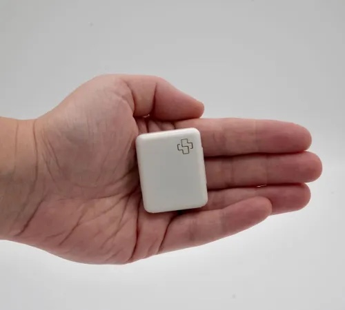 The Perin Health Patch resting in the palm of a hand