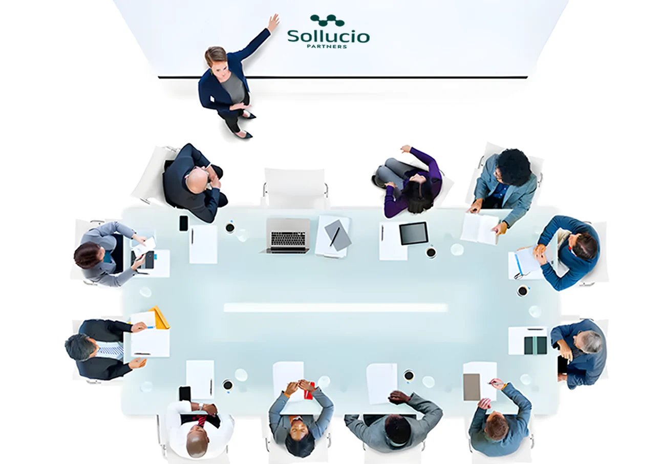 Sollucio Partners team meeting around a conference table